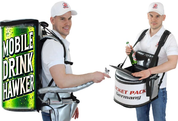 Belly sampling tray vendor enhancing brand presence at cultural events near the iconic Mackinac Bridge, offering a mobile, high-visibility solution for product engagement in a setting rich with heritage and foot traffic. This hands-free, ergonomically designed tray allows vendors to deliver food and beverage samples—ranging from locally inspired treats to nationally recognized products—directly to event attendees. Perfect for festivals, heritage celebrations, and open-air markets, the belly tray combines convenience, branding, and person-to-person interaction to create lasting impressions. Strategically positioned near one of America’s most photographed landmarks, this activation boosts awareness, supports storytelling, and aligns brands with community and culture in a memorable way.